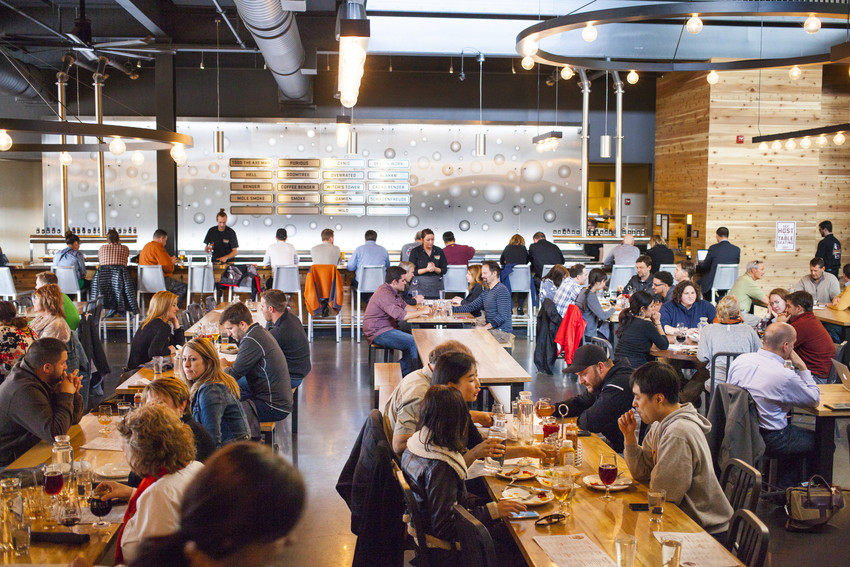 Interior shot of Surly Brewing with a full crowd of people