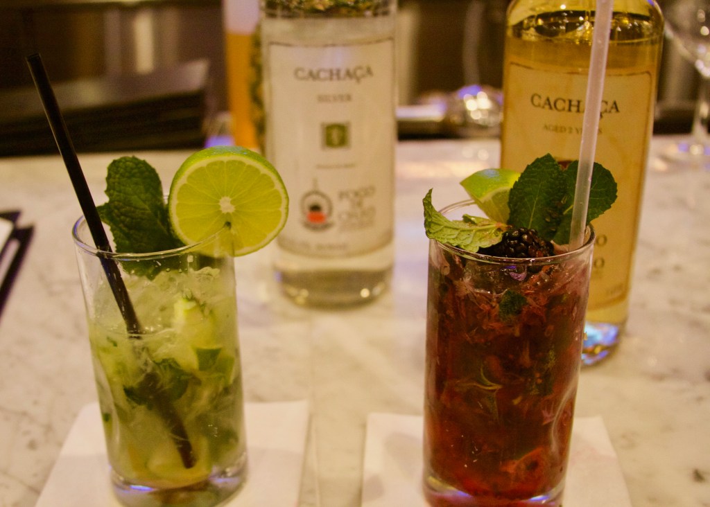 Photo by Lianna Matt. Cocktails at Fogo de Chao. Left, the slightly mint-colored house drink, caipirinha, and on the right, the berry mint.