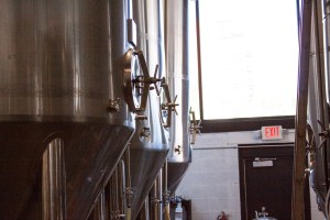 Large fermentation tanks at a brewery.