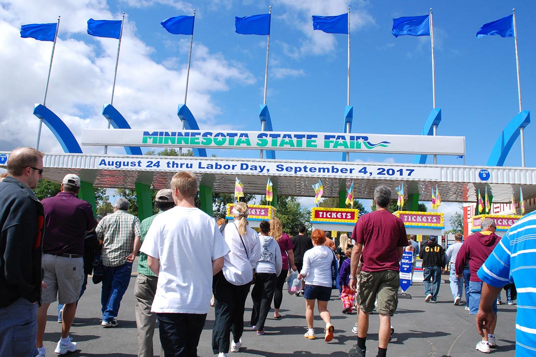 People walking through an entrance to the Minnesota State Fair.