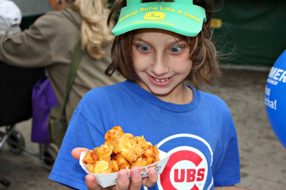 Kid eating cheese curds. Seven Wonders of the Twin Cities.