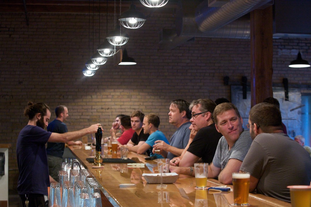 Indeed Brewery Taproom bar with people enjoying a beer